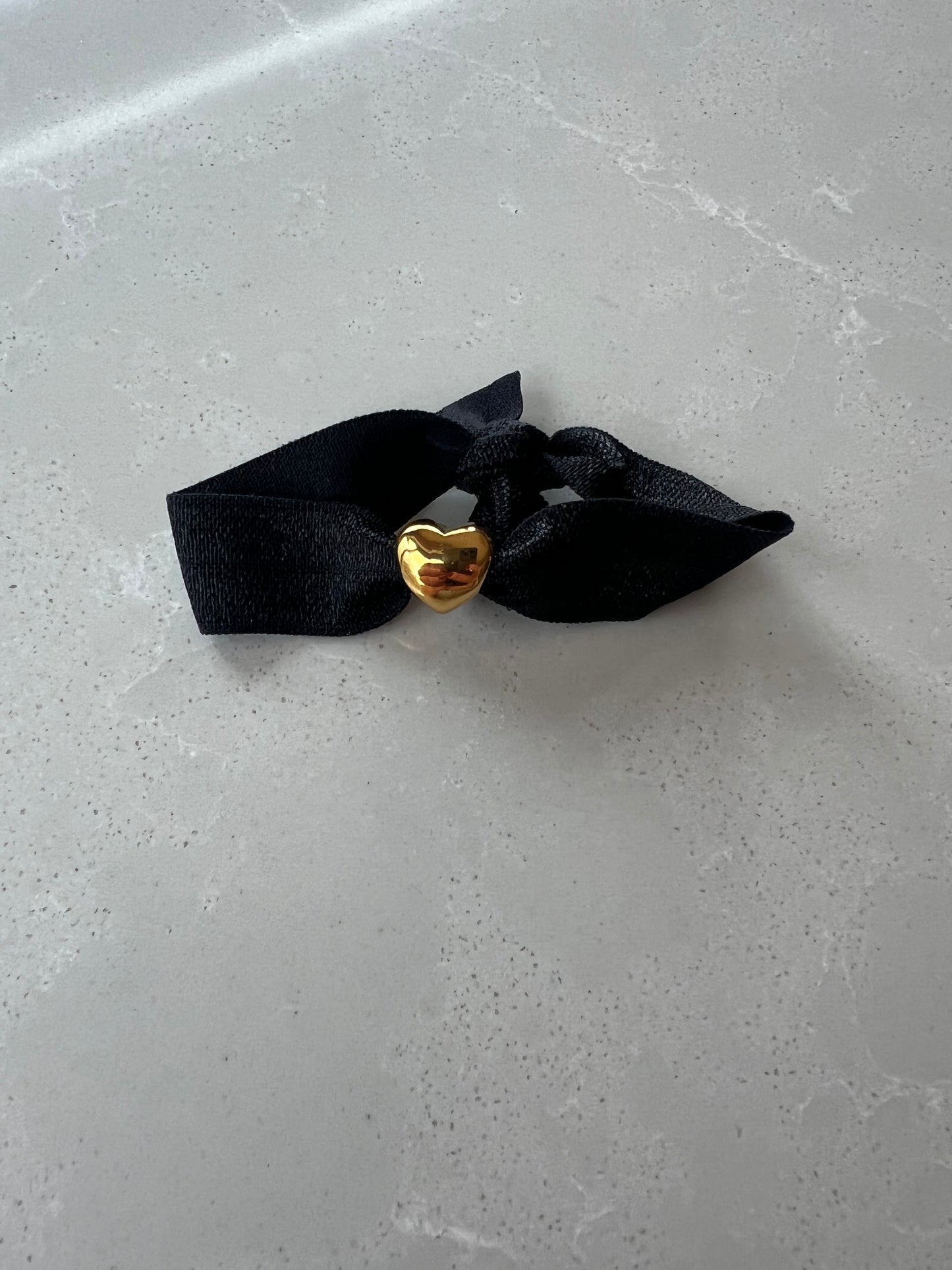 Elastic gold heart bracelet , black