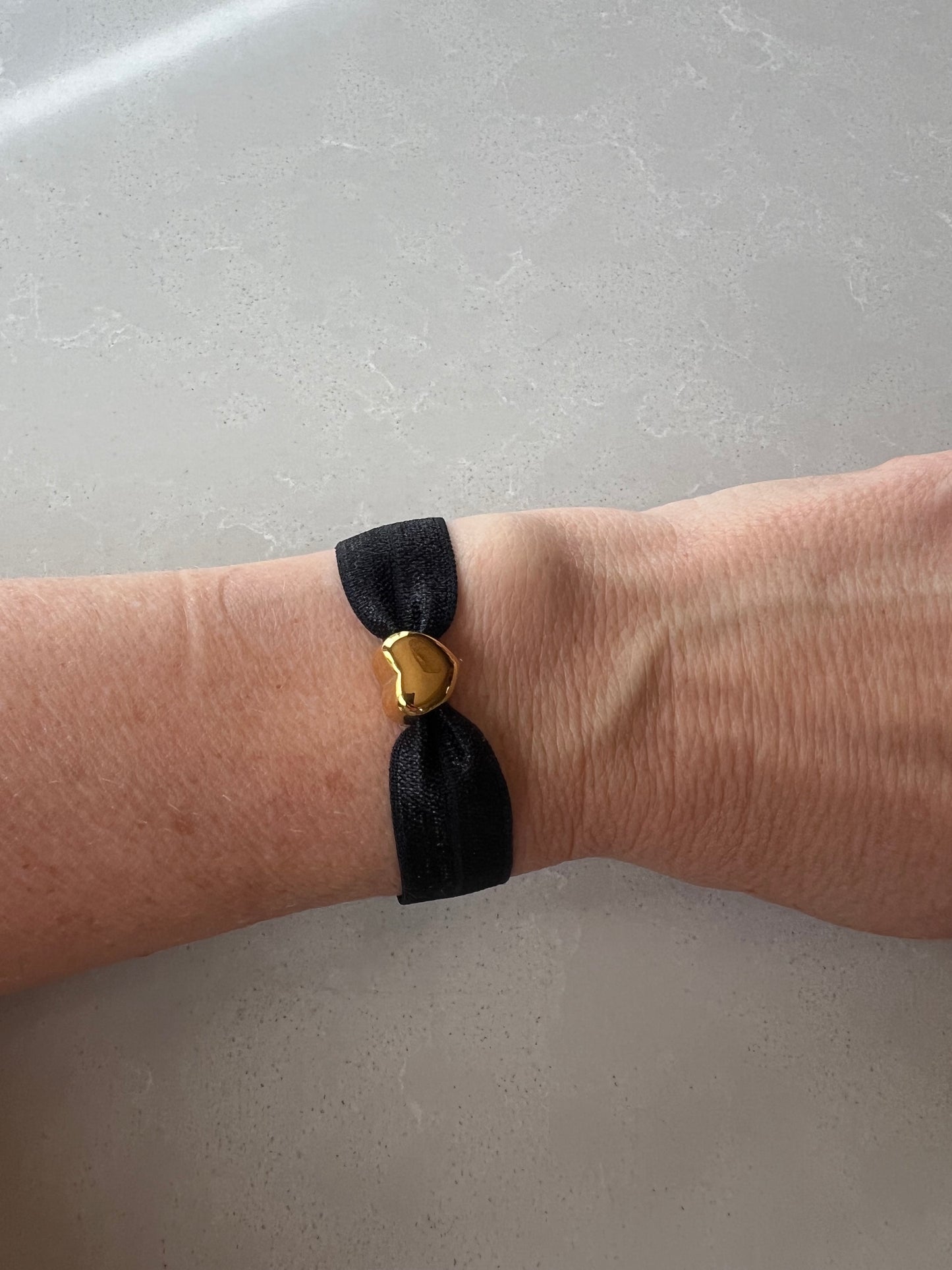 Elastic gold heart bracelet , black