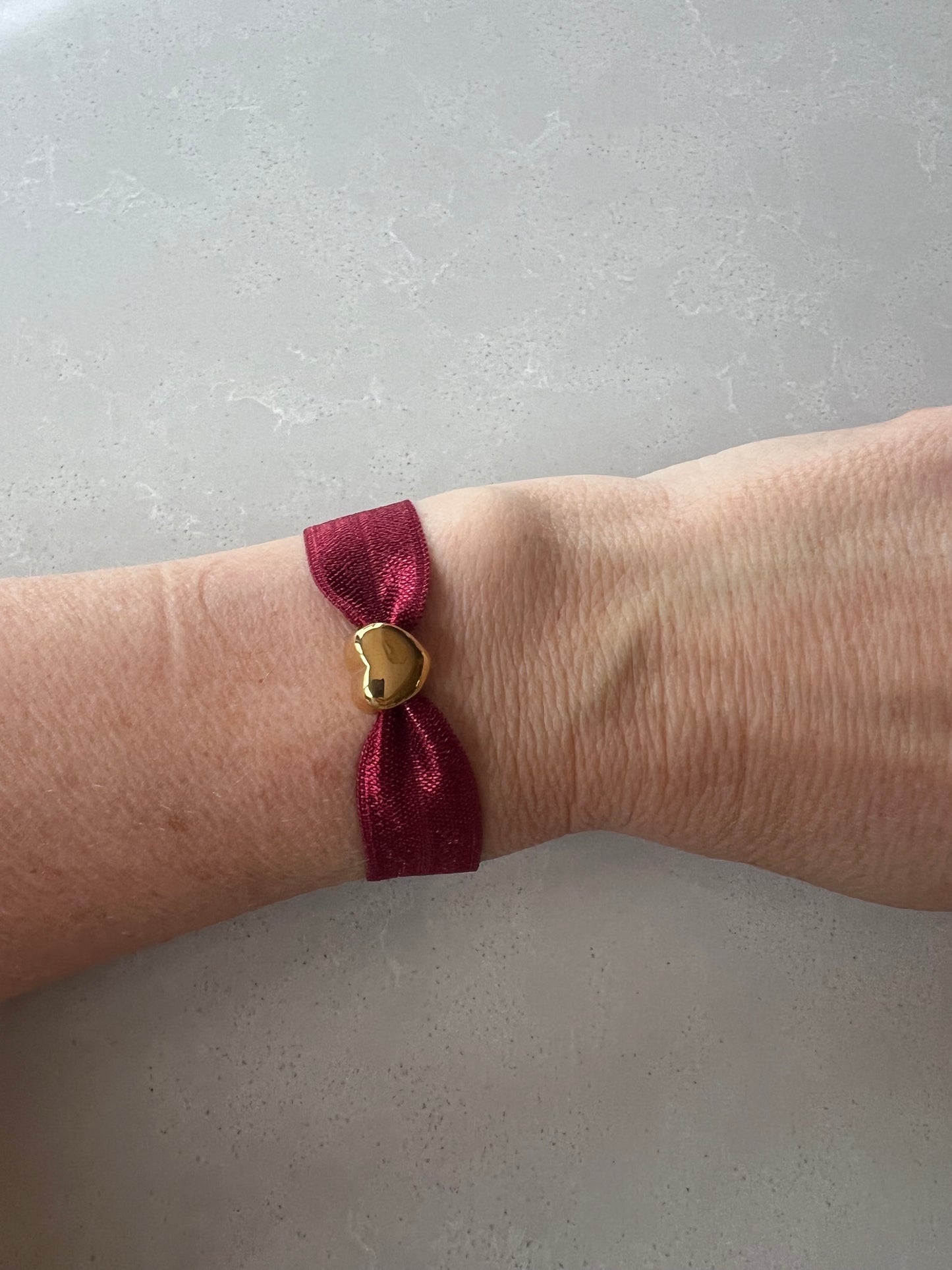 Elastic gold heart bracelet , burgundy