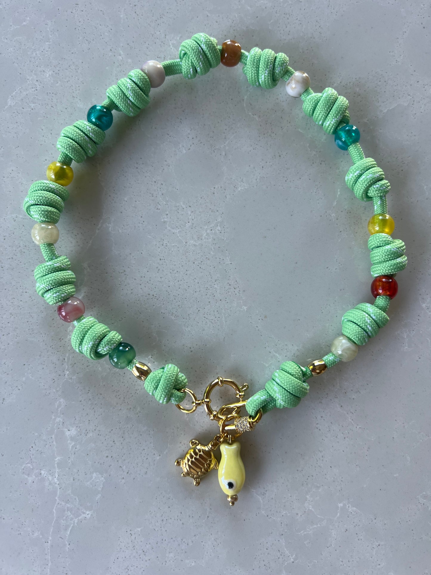 Multi knotted cord necklace with beads and charms #110