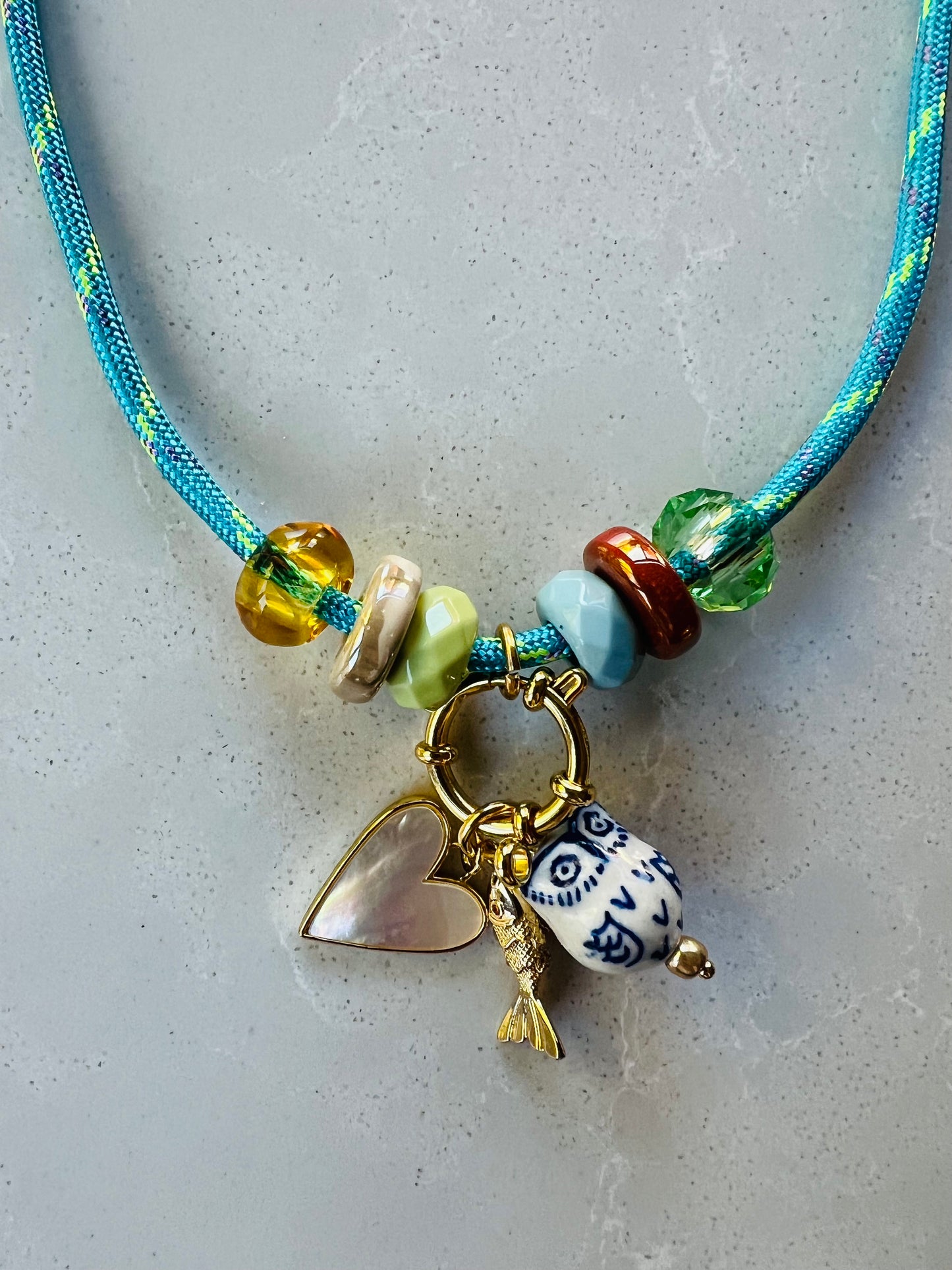 Cord necklace with ceramic beads and charms #09