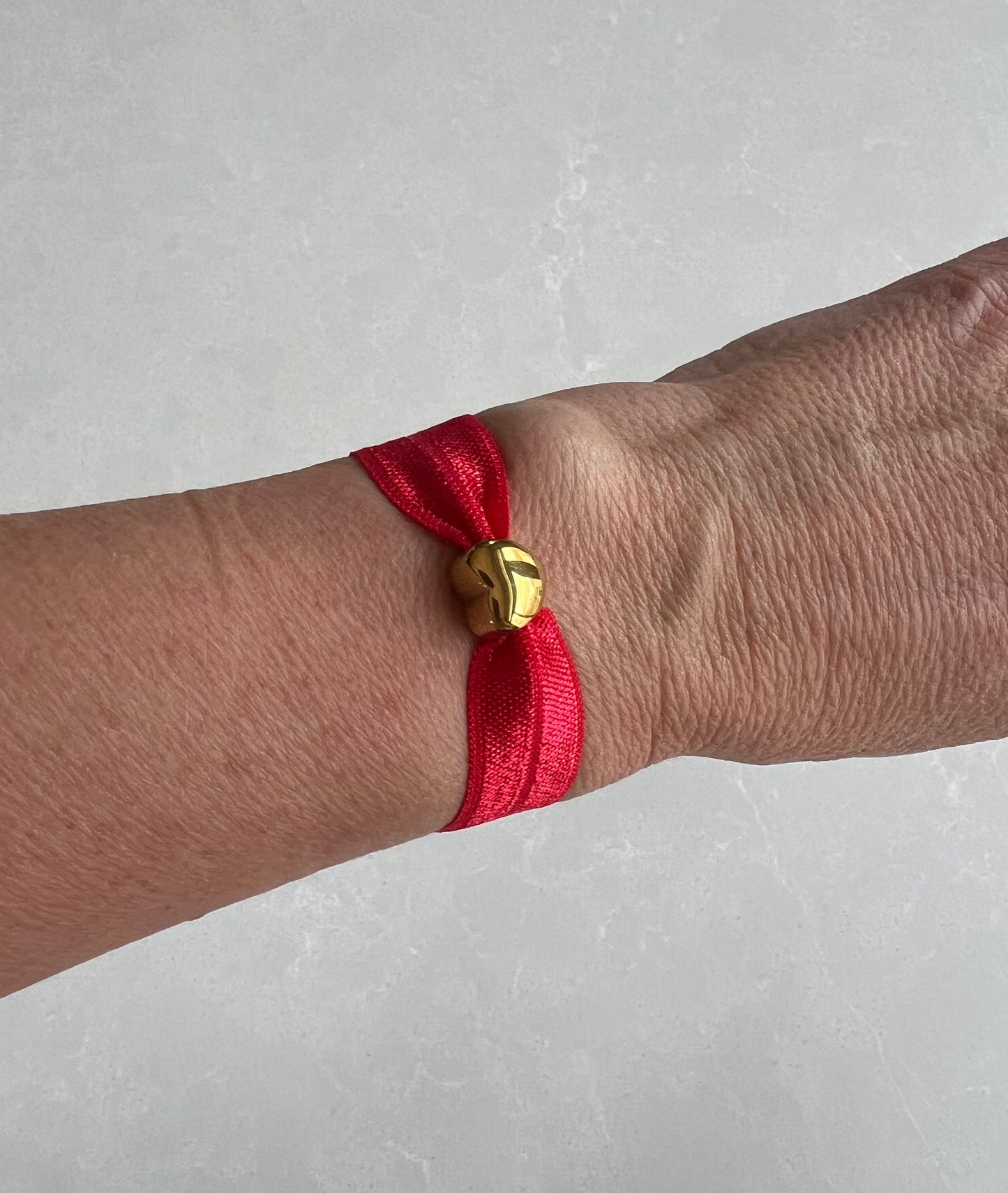 Elastic gold heart bracelet , red